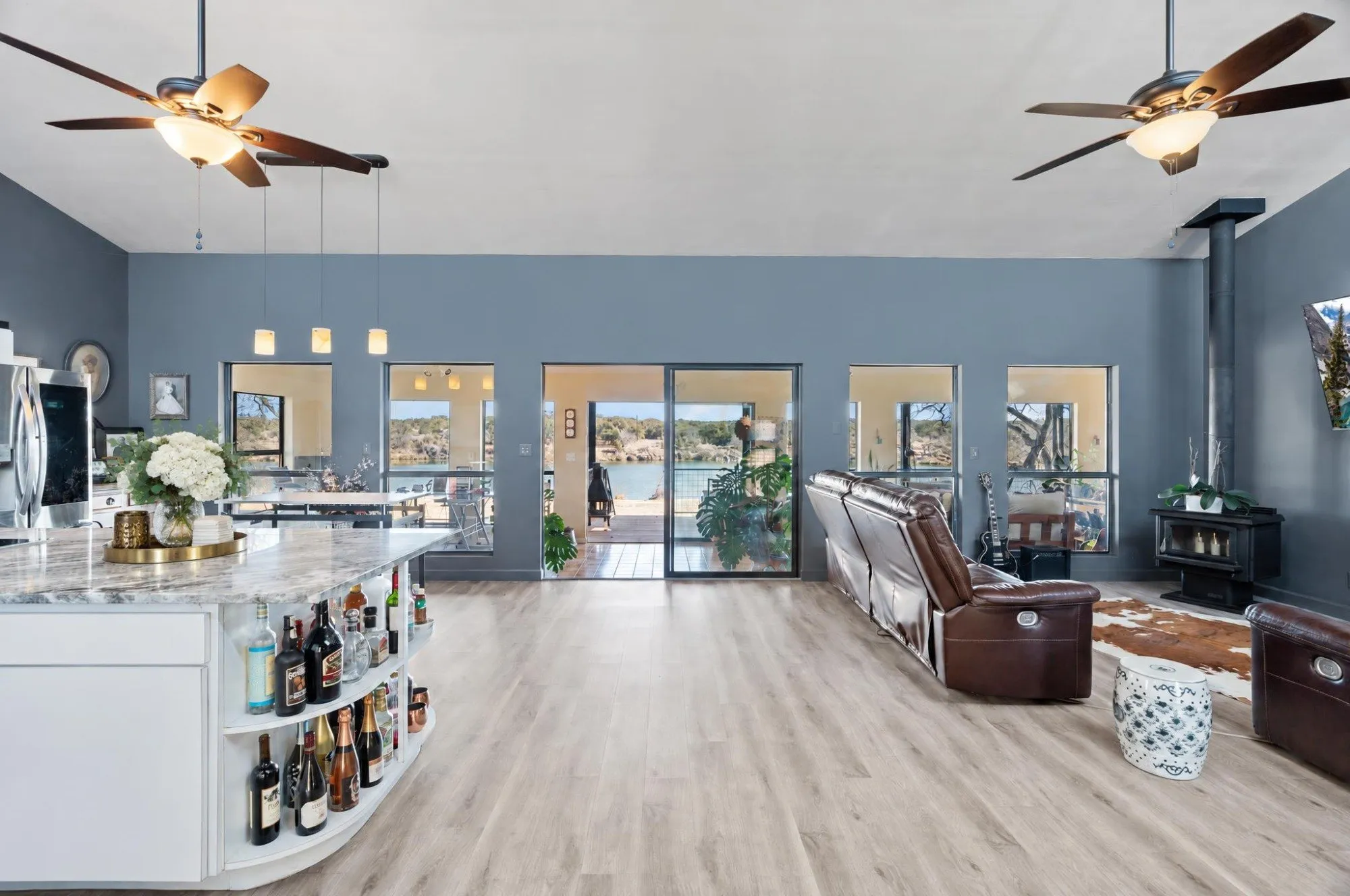 Living room and kitchen at 3721 Lakeview Drive, with sliding doors opening toward the lake.