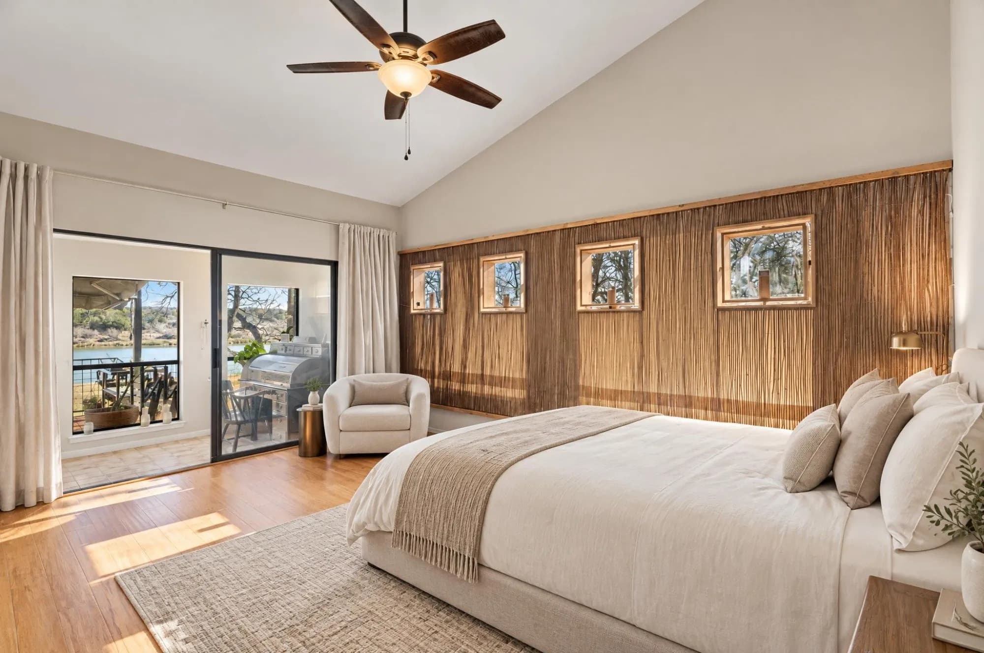 Bedroom at 3721 Lakeview Drive with sliding doors to a deck and a view of the lake.