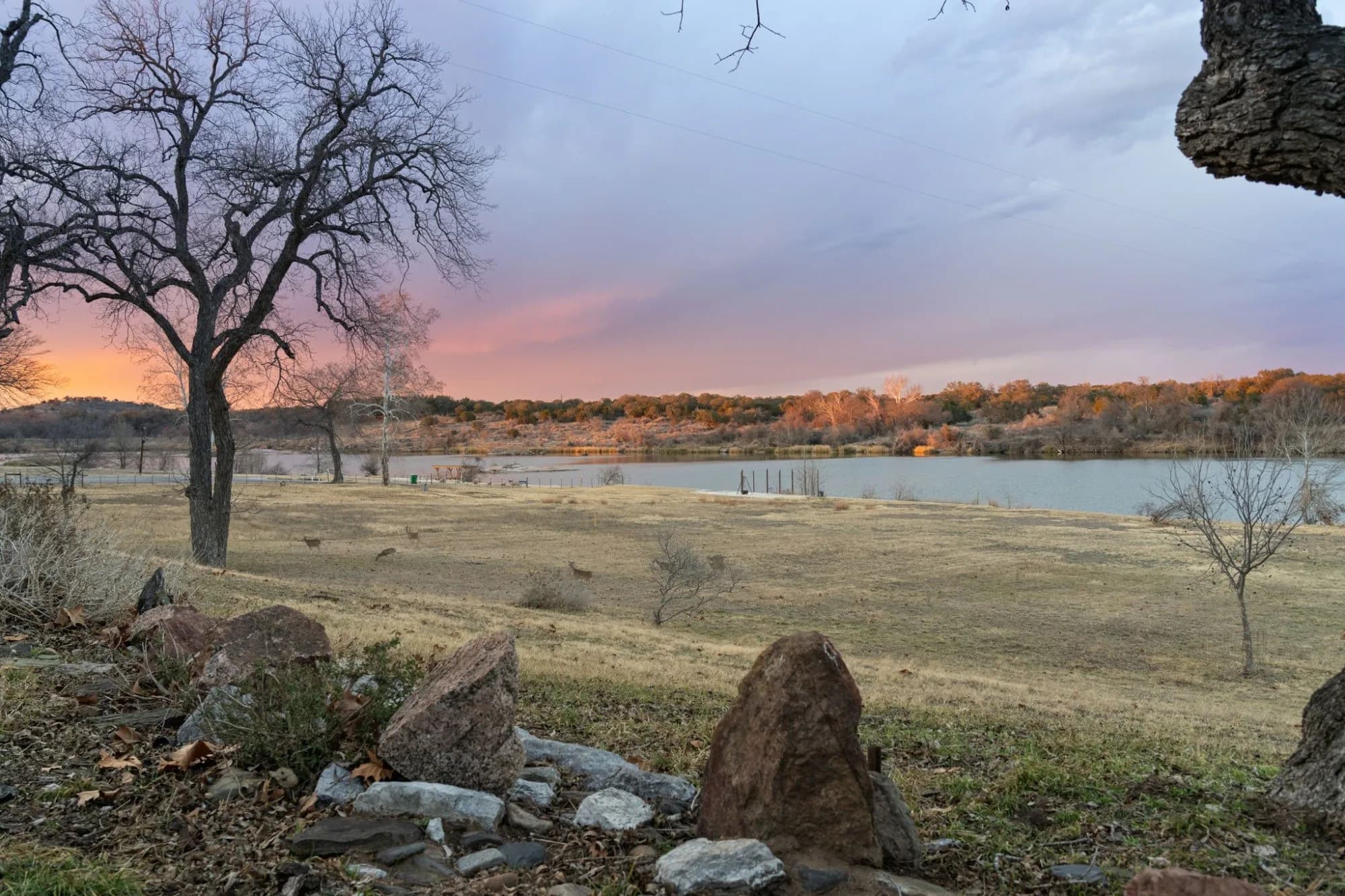 Sunset over the field and shoreline at 3721 Lakeview Drive.