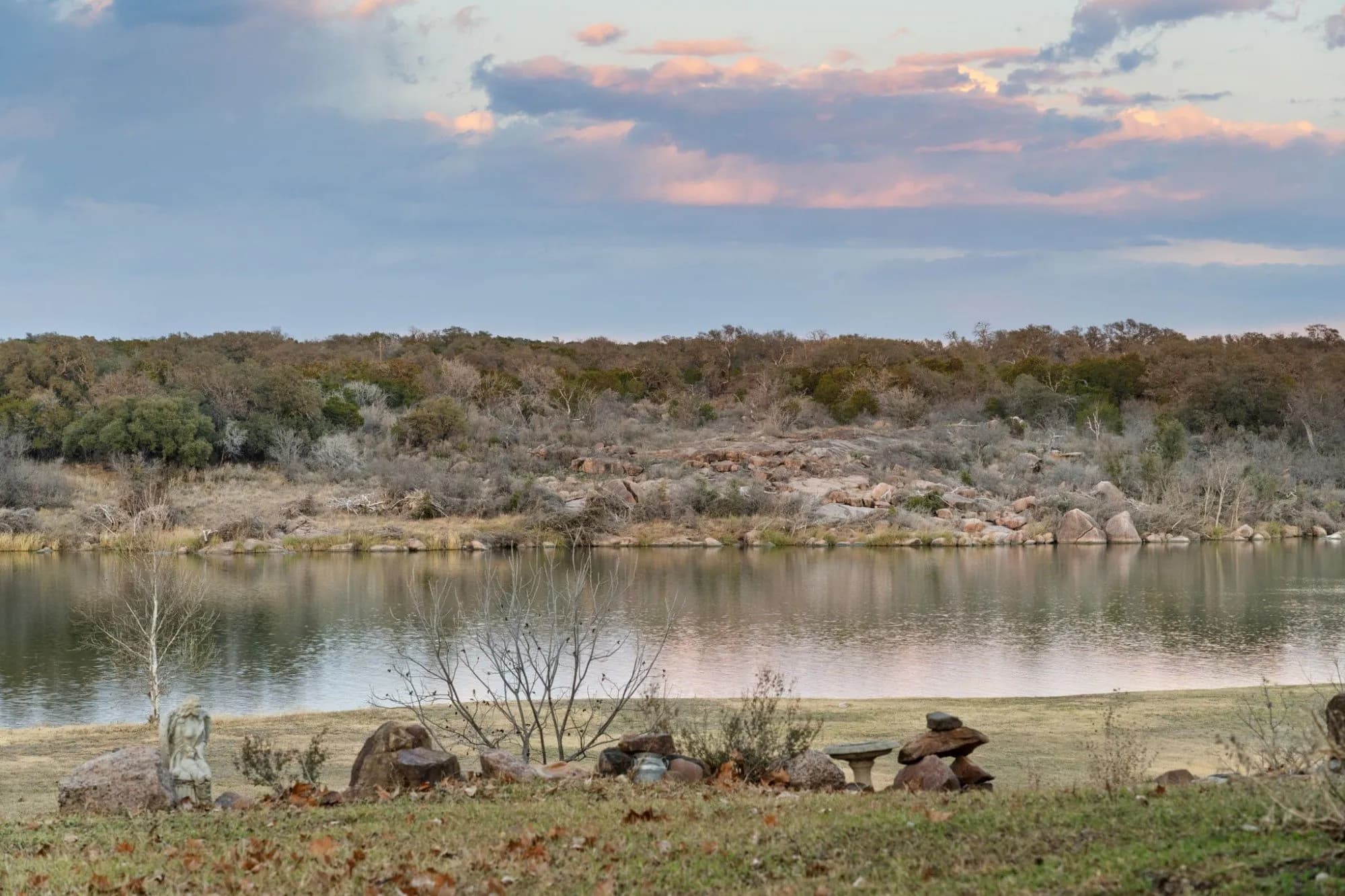 Rocky shoreline of Lake Marble Falls along 3721 Lakeview Drive.