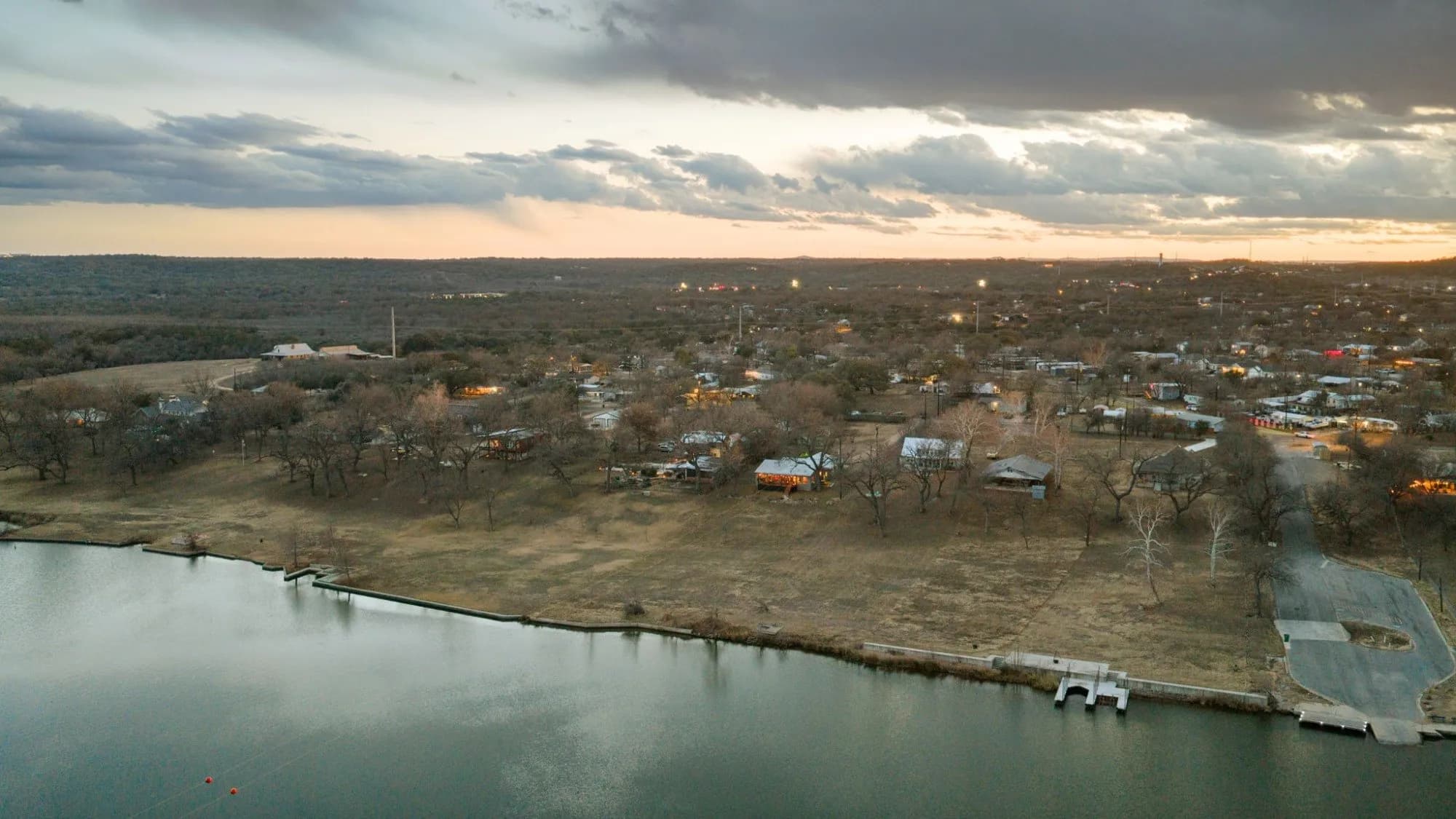 Aerial view of the Lake Marble Falls shoreline near 3721 Lakeview Drive at dusk.